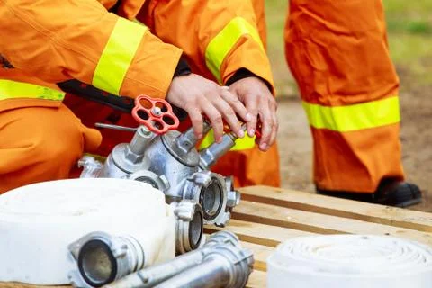 Man opens fire hydrant Stock Photos