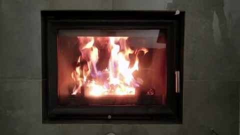 The man opens the fireplace Stock Footage 81800617