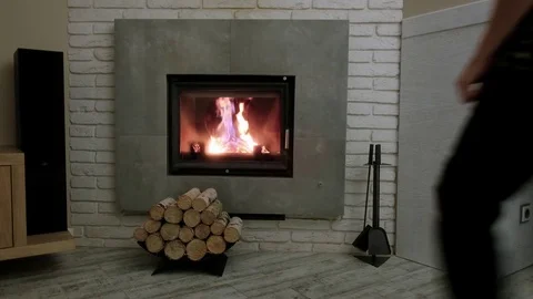 The man opens the fireplace Video stock 81800662
