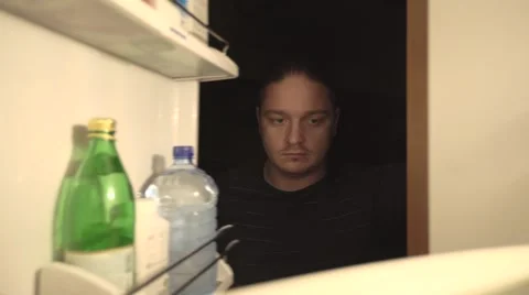 Man opens fridge and takes bananas Stock Footage 68975031