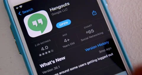 Man opens Google Hangouts app from App Store on iPhone Stock Footage 149464672