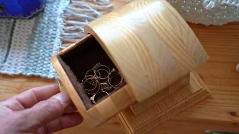 Man opens a hand made jewelry box Stock Footage 345257720