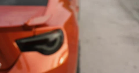 Man opens his car using control remote key pressing button, hand closeup. Stockbeeldmateriaal 131066449