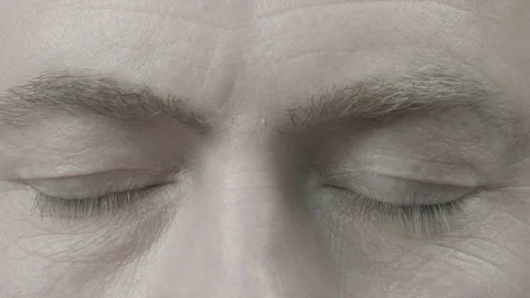 The man opens his closed eyes Stock Footage 74197017