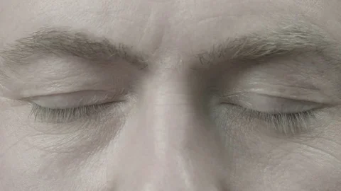 The man opens his closed eyes Stock Footage 74197050