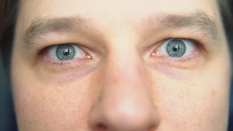 The man opens his eyes, close-up Stock Footage 84568612