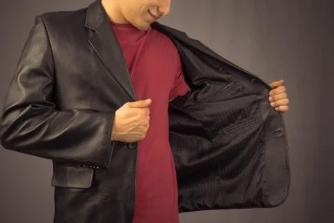 Man opens his jacket Stock Photos
