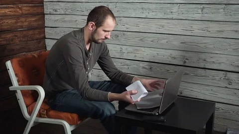 Man opens his mail with bad news. Has problems Vídeo Stock 82446112