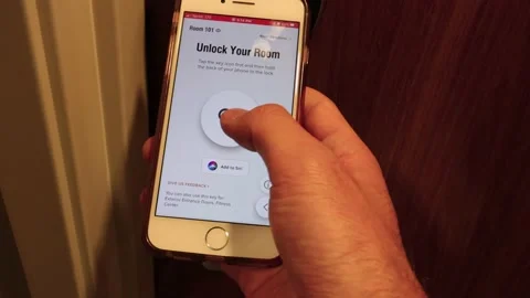 Man opens hotel room door with the smart phone Video stock 149283901