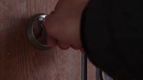 A man opens an iron lock with a key Stock Footage 177506921