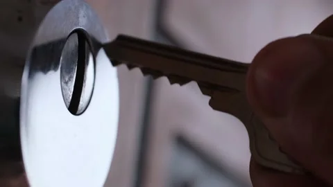 A man opens an iron lock with a key Stock Footage 177507111