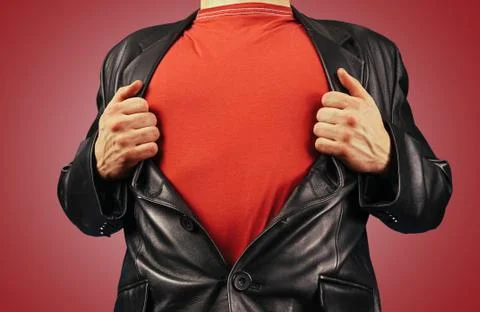 Man opens jacket showing red t-shirt Stock Photos