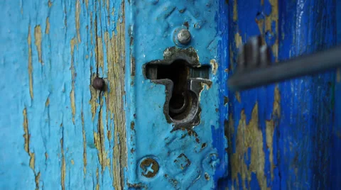 Man opens keyhole key Stock Footage 53874885