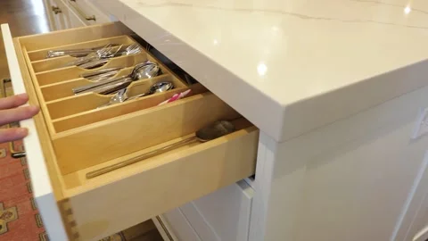 Man opens a kitchen drawer with spoons and forks Video stock 148037014