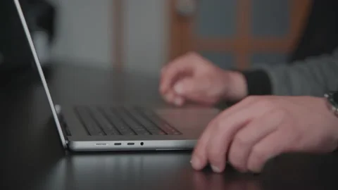 Man opens laptop, inserts reduction into usb c port, write on the keyboard an Stock Footage 189855427