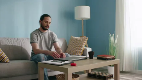 Man Opens Laptop to Work at Home Stock Footage 130447852