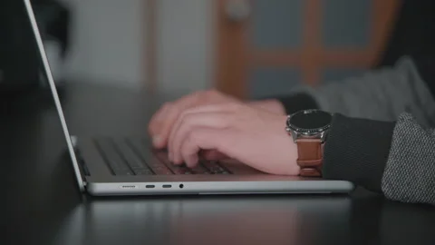 Man opens laptop, write on the keyboard and closes laptop in the office Stock Footage 186951941