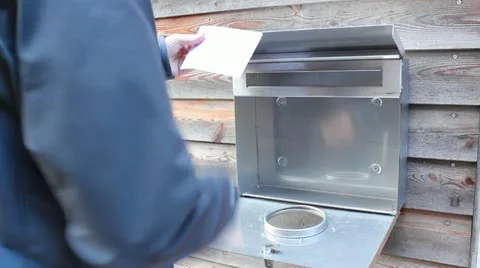 Man opens a letterbox and get out a letter Stock Footage 12402646