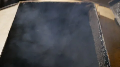 Man opens the loading door of the solid fuel boiler Stock Footage 169288718