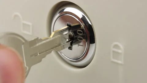 Man opens lock with key, close-up view on larva of lock of safe or cash drawer Video stock 145535894