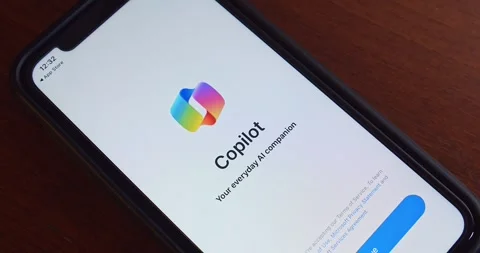 Man opens Microsoft Copilot app from App Store on iPhone screen Video stock 260276586