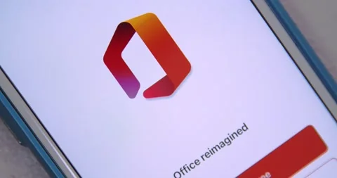Man opens Microsoft Office App from Office Suit folder on iPhone Stock Footage 150075285
