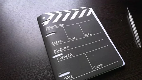 The man opens the notebook, and begins to quickly flip through all the pages Stock Footage 160554697