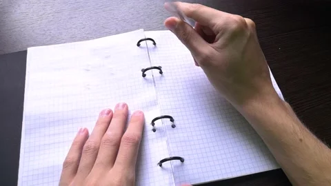 The man opens a notebook, takes a pen, but does not know what to write in it Stock Footage 160555736