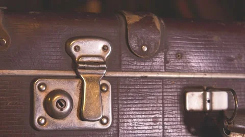 The man opens an old battered brown suitcase. Stock Footage 137738316