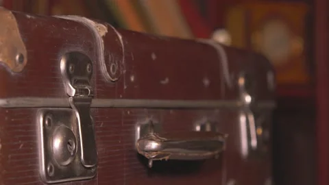 The man opens an old battered brown suitcase. Stock Footage 137738440