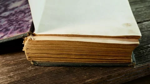 Man opens an old , worned , ancient book Stock Footage 307172633