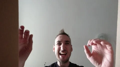 A man opens an ordered cardboard package 動画素材 131223416