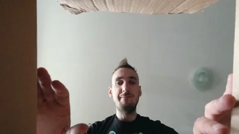 A man opens an ordered cardboard package. Stock Footage 131224295