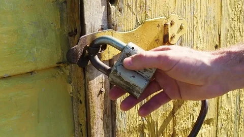 The man opens the padlock Video stock 108764308