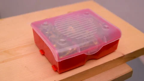 A man opens a plastic box with the screws. Stock Footage 128872796