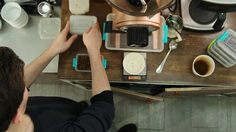 Man opens plastic container filled with coffee beans Stock Footage 268816763