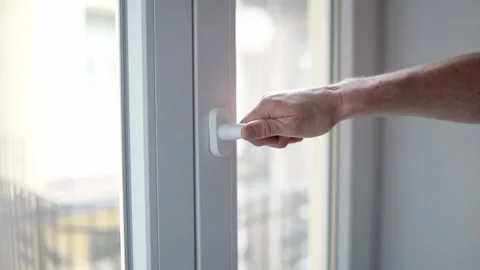 Man opens a plastic window Stock Footage 232309689