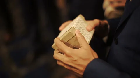 Man opens present box a Stock Footage 68995857