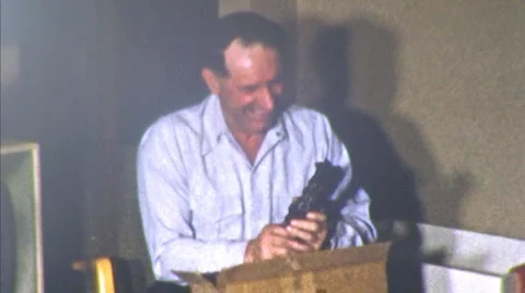 Man Opens Present CHRISTMAS Toy Train Xmas 1950s Vintage Film Home Movie 18 Video stock 6523758