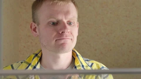 Man opens the refrigerator and looks inside Stock Footage 152298320