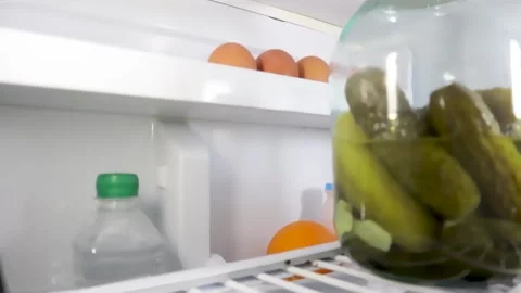 A man opens the refrigerator door and takes food Video stock 131133046