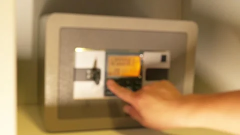 A man opens a safe and takes out Chinese cash Stock Footage 277864521