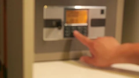 A man opens a safe and takes out Chinese cash 스톡 동영상 277864625