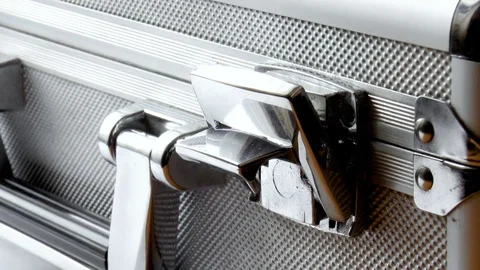 Man opens a silver case Stock Footage 78914937