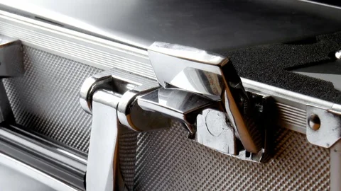 Man opens a silver case Stock Footage 79100153