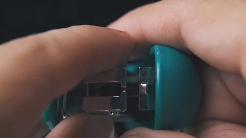 man opens small stapler to put in clips ... | Stock Video | Pond5