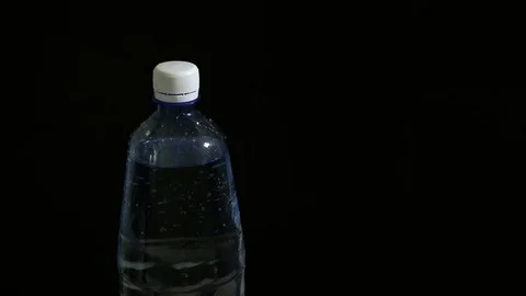 Man opens soda in plastic bottle Stock Footage 74169330