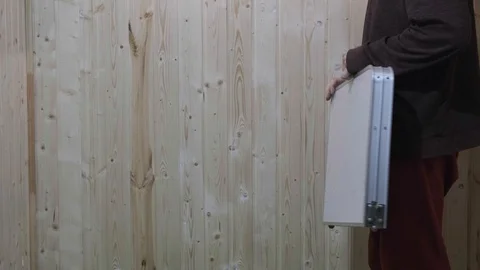 The man opens the suitcase which becomes a folding table Stock Footage 119553925