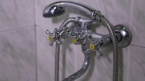 The man opens the tap water in the bathroom Stock Footage 60342796