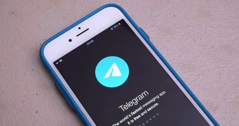 Man opens Telegram app and watches its introduction on an iPhone Stock Footage 175220470